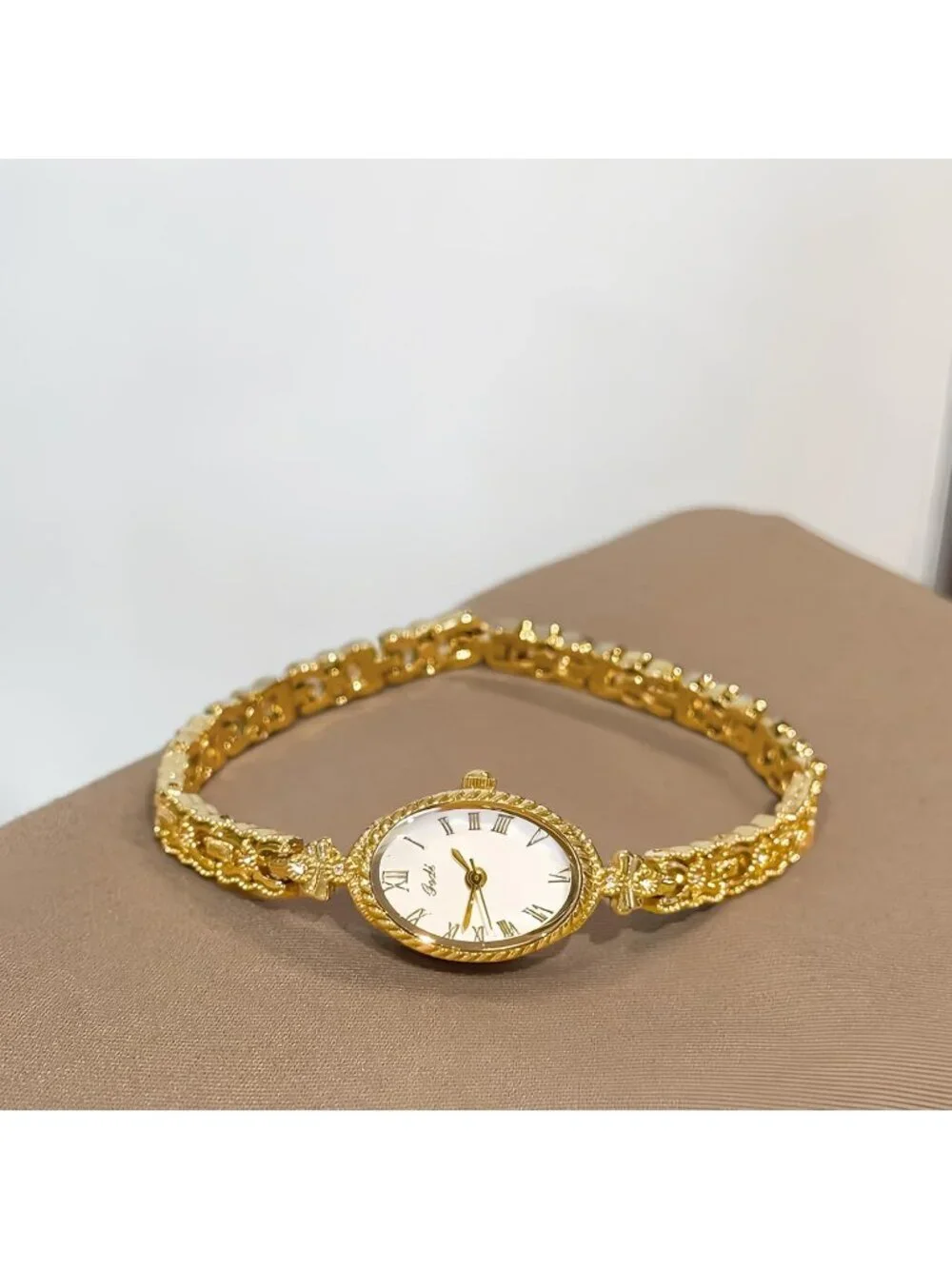 Women's Gold White Analog Quartz Alloy Steel Oval Roman Numeral Bracelet Watch